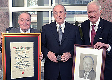 Dr. George Reul accepts the 2012 Ray C. Fish award from Dr. James T. Willerson (left) and Dr. Denton A. Cooley (right) Dr. George Reul accepts the 2012 Ray C. Fish award from Dr. James T. Willerson (left) and Dr. Denton A. Cooley (right)