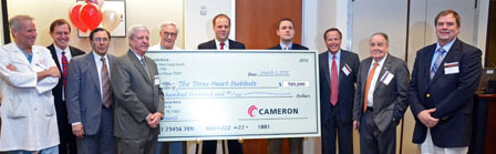 Cameron's engineering team presents a check for $500,000 to Texas Heart Institute. Cameron's engineering team presents a check for $500,000 to Texas Heart Institute.